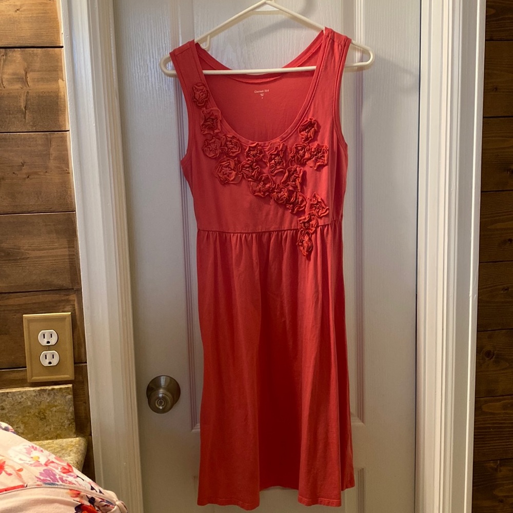 Perfect sundress! Soft knit material with fun floral appliqué along bodice!